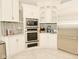 Kitchen boasts stainless steel appliances, microwave, oven, and custom cabinets at 2004 Caledonian Ct, Greenwood, IN 46143