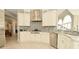 Gourmet kitchen with stainless steel appliances, custom cabinets, and decorative backsplash at 2004 Caledonian Ct, Greenwood, IN 46143