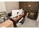 Home office with a large desk, multiple monitors, and comfortable seating at 2004 Caledonian Ct, Greenwood, IN 46143