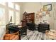 Office featuring built-in shelves, large windows, and a comfortable workspace at 2004 Caledonian Ct, Greenwood, IN 46143