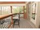 Outdoor porch with a bar and chairs offering a cozy space to enjoy the natural outdoor surroundings at 2004 Caledonian Ct, Greenwood, IN 46143