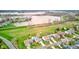 Aerial view of a community by a lake, emphasizing neighborhood layout and proximity to waterfront amenities at 20107 Marie Ct, Noblesville, IN 46062