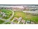 Wide aerial view of homes near a lake, highlighting community amenities and neighborhood street layout and proximity to water at 20107 Marie Ct, Noblesville, IN 46062