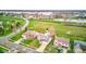 Aerial view of homes with a lake in the background, showcasing community layout and properties with backyard pools at 20107 Marie Ct, Noblesville, IN 46062