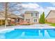 Backyard view of the in-ground swimming pool and spacious deck at 20107 Marie Ct, Noblesville, IN 46062