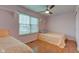 Bedroom with two twin beds, ceiling fan, and window at 20107 Marie Ct, Noblesville, IN 46062