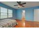 Spacious bedroom with wood floors and view into the bathroom at 20107 Marie Ct, Noblesville, IN 46062