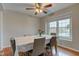 Charming dining room with laminate floors, a floral tablecloth and a ceiling fan at 20107 Marie Ct, Noblesville, IN 46062
