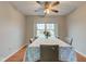 Cozy dining room with laminate floors, a floral tablecloth and a ceiling fan at 20107 Marie Ct, Noblesville, IN 46062