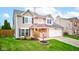 Charming two-story home with vinyl siding, attached garage, manicured lawn, and stylish landscaping at 20107 Marie Ct, Noblesville, IN 46062