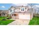 Exterior elevation showing front yard and two-car garage at 20107 Marie Ct, Noblesville, IN 46062
