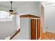Well-lit hallway with wood accents, built-in storage and ceiling fan at 20107 Marie Ct, Noblesville, IN 46062