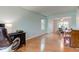 Bright living room with laminate floors connecting to dining area, featuring a stylish workspace at 20107 Marie Ct, Noblesville, IN 46062