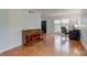 Open-concept living area with wood-look flooring and views into the dining area at 20107 Marie Ct, Noblesville, IN 46062