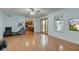 Spacious living room featuring hardwood floors and natural light, next to the kitchen and patio doors at 20107 Marie Ct, Noblesville, IN 46062
