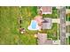 Aerial shot of a backyard pool in a fenced yard, with lawn and residential surroundings, highlighting outdoor living at 20107 Marie Ct, Noblesville, IN 46062
