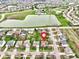 A beautiful suburban home is situated near a serene lake and lush green spaces in this scenic aerial view at 203 Winslow Dr, Westfield, IN 46074