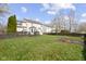 Expansive backyard with well-maintained lawn, wooden deck, and privacy fence offering plenty of space at 203 Winslow Dr, Westfield, IN 46074