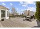Wooden deck, perfect for outdoor entertaining, with a dining set and backyard view at 203 Winslow Dr, Westfield, IN 46074