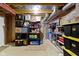 Unfinished basement featuring storage shelves and essential utilities at 203 Winslow Dr, Westfield, IN 46074