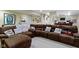 Spacious basement featuring a large sectional sofa with decorative pillows at 203 Winslow Dr, Westfield, IN 46074