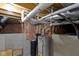 Unfinished basement with exposed pipes, water heater, and utility systems at 203 Winslow Dr, Westfield, IN 46074