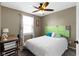 A charming bedroom with a cozy bed, a unique headboard, and a desk for study at 203 Winslow Dr, Westfield, IN 46074