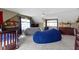 This cozy bedroom features a soft carpet, comfortable beanbag chairs, and a ceiling fan at 203 Winslow Dr, Westfield, IN 46074