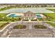 An aerial view of the community pool and amenity center; a lake provides a beautiful background at 203 Winslow Dr, Westfield, IN 46074