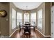 Cozy dining area with a chandelier, views from several windows, and hardwood floors at 203 Winslow Dr, Westfield, IN 46074