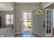 Bright entryway with front door and view of landscaped front yard at 203 Winslow Dr, Westfield, IN 46074