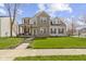Charming two-story home with brick accents, covered front porch, and well-manicured lawn at 203 Winslow Dr, Westfield, IN 46074