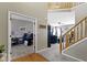 Hallway connecting living spaces with view of staircase and office at 203 Winslow Dr, Westfield, IN 46074