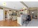 Open concept kitchen features pendant lighting, stainless appliances, an island, and eat-in bar seating at 203 Winslow Dr, Westfield, IN 46074