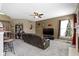 Comfortable living room features neutral paint, a ceiling fan, carpet flooring, and a cozy fireplace at 203 Winslow Dr, Westfield, IN 46074