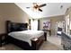 Comfortable main bedroom with a king-size bed, ceiling fan, and lots of natural light at 203 Winslow Dr, Westfield, IN 46074