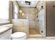 Modern shower with glass enclosure, rainfall shower head, and custom tile work at 203 Winslow Dr, Westfield, IN 46074