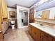 Full bathroom with a shower, single sink vanity and medicine cabinet at 204 W Berry St, Alexandria, IN 46001