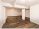Finished basement with wood-look vinyl floors and white painted walls and ceiling at 2134 Dawson St, Indianapolis, IN 46203