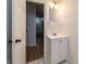 Bathroom featuring new cabinet, sink and mirror, as well as updated floors at 2134 Dawson St, Indianapolis, IN 46203