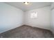 Carpeted bedroom with natural light from a window, and a closet for storage at 2134 Dawson St, Indianapolis, IN 46203