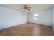Bright bedroom with a ceiling fan, new hardwood flooring, and a window for natural light at 2134 Dawson St, Indianapolis, IN 46203