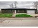 Charming single-story home with a brick exterior, front yard, and attached garage for convenient parking at 2134 Dawson St, Indianapolis, IN 46203