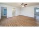 Bright and spacious living room featuring modern wood-look floors, with an open view to other rooms at 2134 Dawson St, Indianapolis, IN 46203