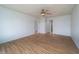 Spacious living room featuring a ceiling fan, fresh paint and luxury vinyl plank flooring at 2134 Dawson St, Indianapolis, IN 46203