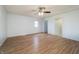 Spacious living room with wood-look flooring, a ceiling fan, and plenty of natural light at 2134 Dawson St, Indianapolis, IN 46203