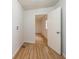 View of the room with wood-look flooring and a door leading to a bright space at 2134 Dawson St, Indianapolis, IN 46203