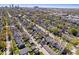 Expansive aerial shot featuring a residential area with tree-lined streets and a distant cityscape at 2349 N Delaware St, Indianapolis, IN 46205