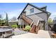 Backyard featuring a hot tub, outdoor seating, and stairs leading to an upper entrance at 2349 N Delaware St, Indianapolis, IN 46205