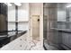 Modern bathroom with dual vanity, glass shower, and marble flooring at 2349 N Delaware St, Indianapolis, IN 46205
